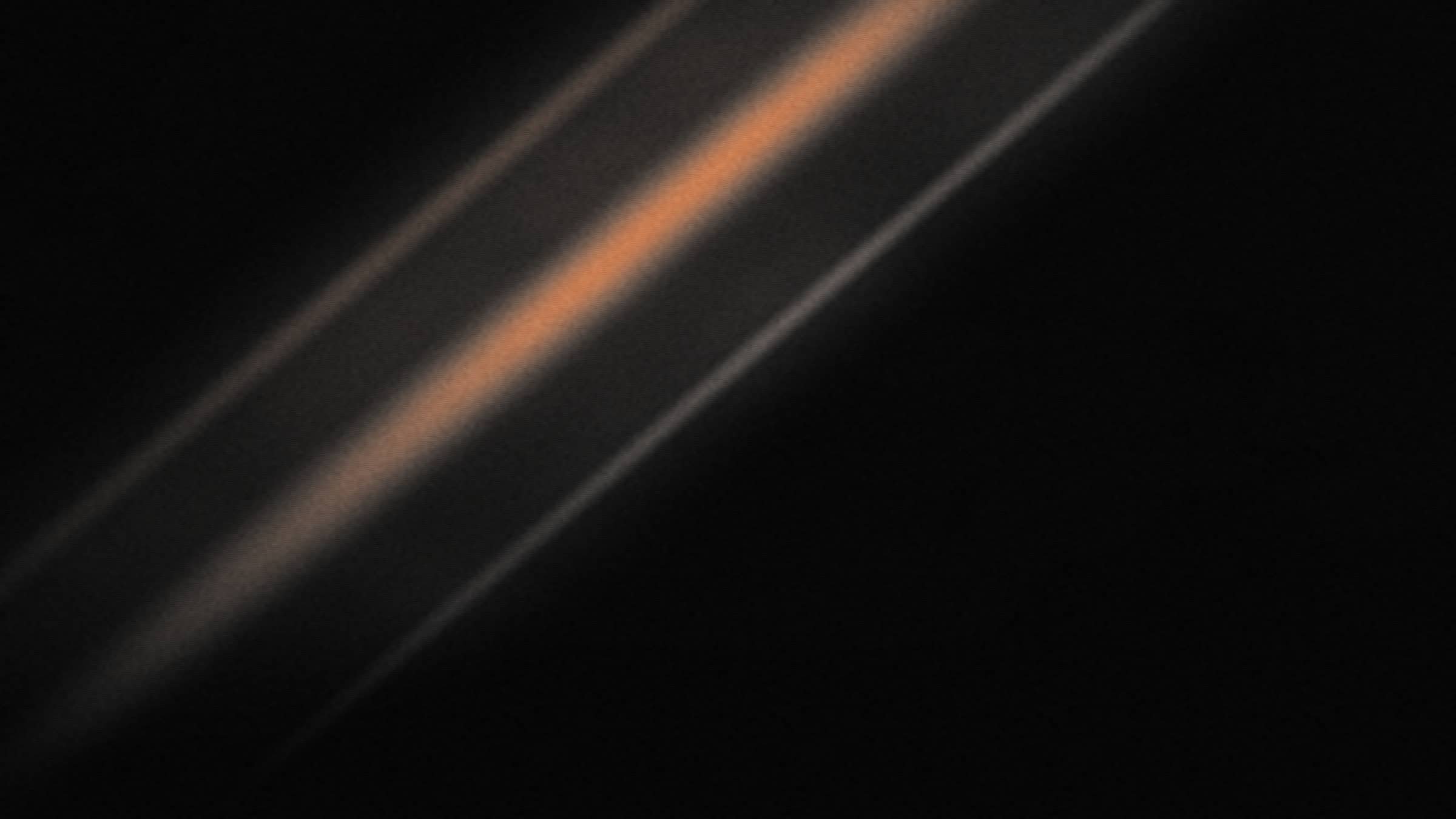 Ghazalium key art — shafts of hard light crossing a dark room, heavy film grain.