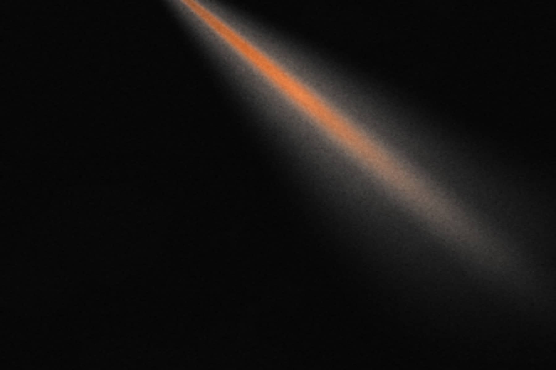 Placeholder live photograph — a stage beam cutting through haze.