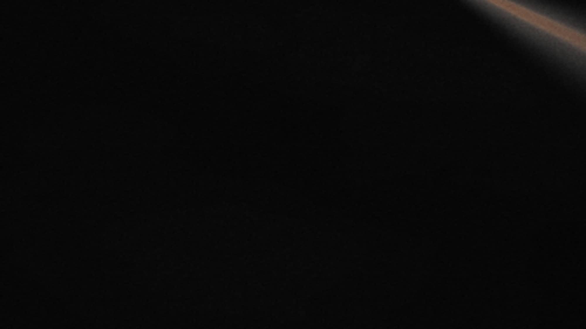 Placeholder still for the Kohl video — a beam of light cutting through haze.